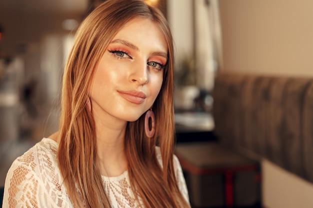 Beautiful female model portrait in a cafe