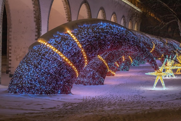 Beautiful festive illuminations on the snow background close up Rostokino district MoscowRussia