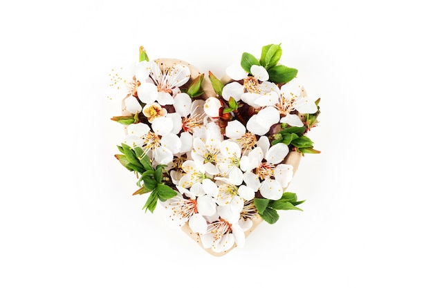 Beautiful  floral arrangements. Spring flowers in the shape of heart.  Flat lay, top view.