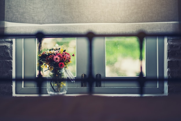 Beautiful flowers near the window