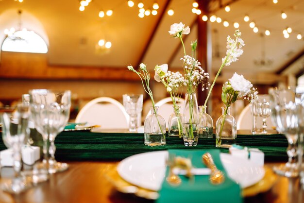 Beautiful flowers on table in wedding day Beautiful table setting for a party reception.