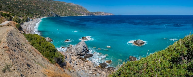 Beautiful foamy waves on the beach in Aegean sea in Greece