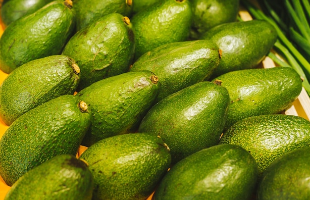 Beautiful and fresh avocado on a shelf in a supermarket Seasonal and exotic vegetables and fruits