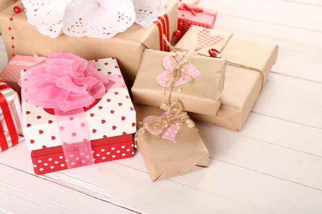 Beautiful gift boxes on wooden background. Valentine Day concept