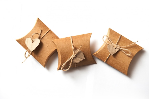 Beautiful gifts of kraft paper with a heart on white