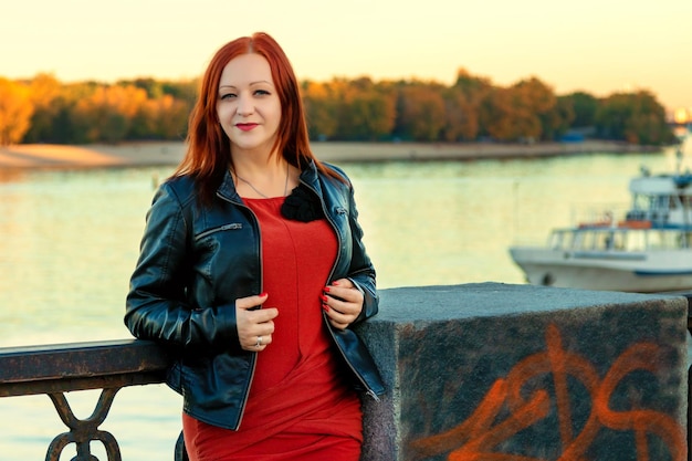 Beautiful girl on the background of the river