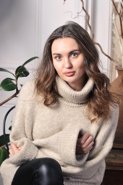 Beautiful girl in beige sweater