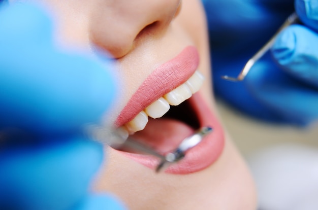 Beautiful girl in the dental chair on the examination at the dentist