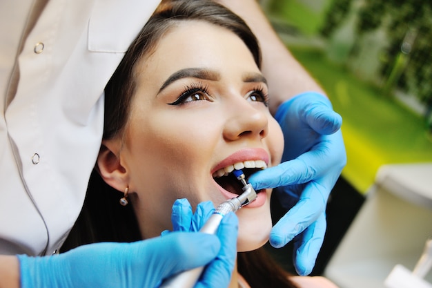 Beautiful girl in the dental chair on the examination at the dentist