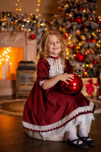 Beautiful girl in a festive dress at home