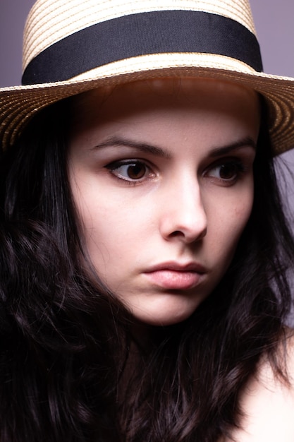 beautiful girl in the hat portrait studio