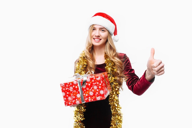 Beautiful girl in the hat of Santa Claus