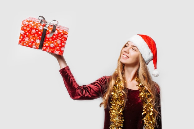 Beautiful girl in the hat of Santa Claus