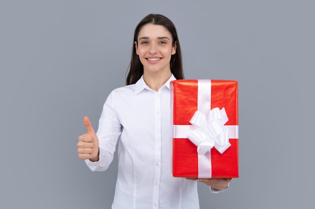 Beautiful girl holding valentines gift Happy birthday celebration woman day christmas Woman holding gift box and rejoices