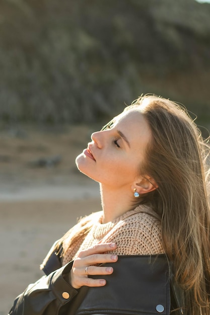 A beautiful girl is enjoying the sun Beautiful woman