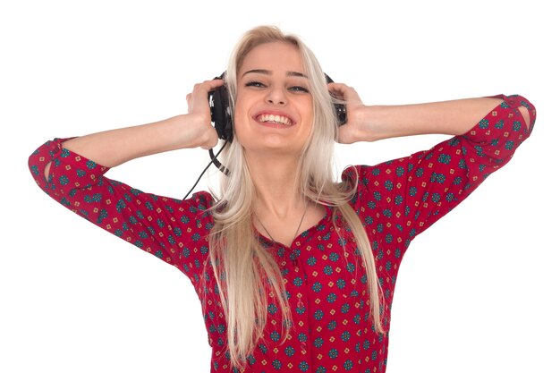 Beautiful girl listens to music on headphones