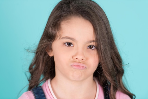 Beautiful girl looking sad with pouted lips