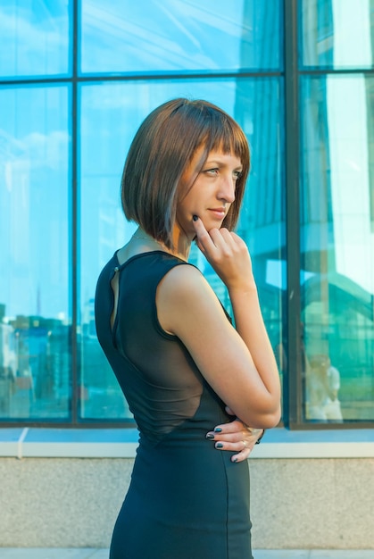 A beautiful girl poses in the business center