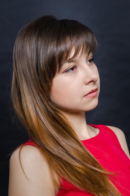 Beautiful girl posing in a dark studio