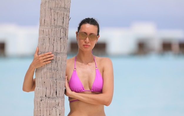 beautiful girl in a purple bikini on a seascape