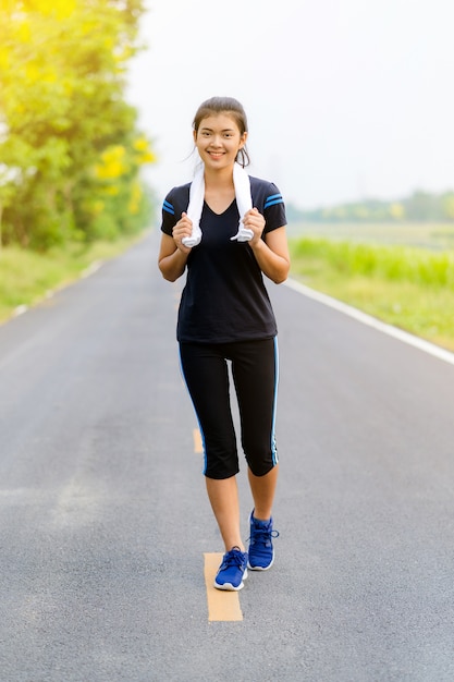 Beautiful girl running on road, Healthy fitness woman training