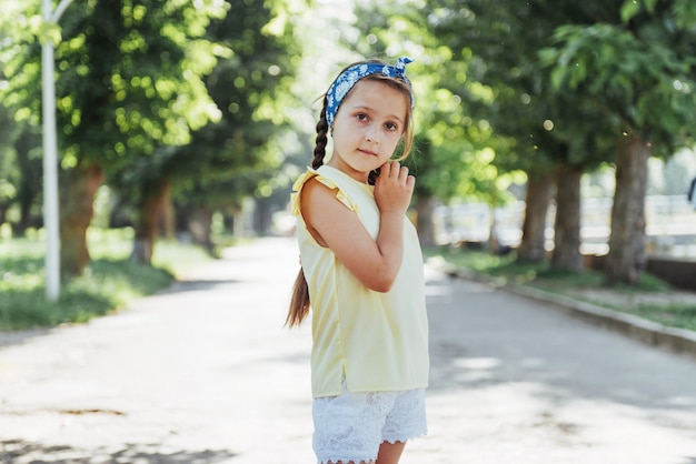 Beautiful girl in a summer sunny day