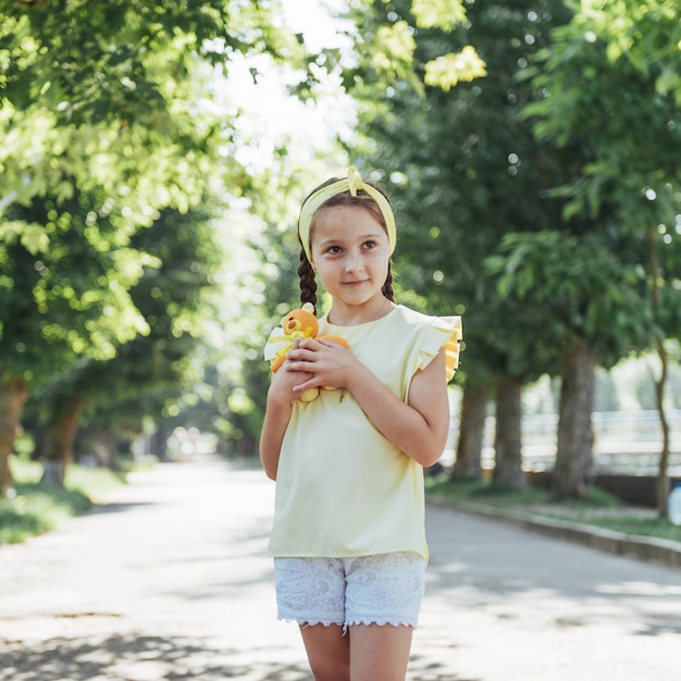 Beautiful girl in a summer sunny day