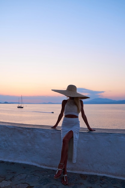 Beautiful girl tourist walking in the streets of Hydra Greece