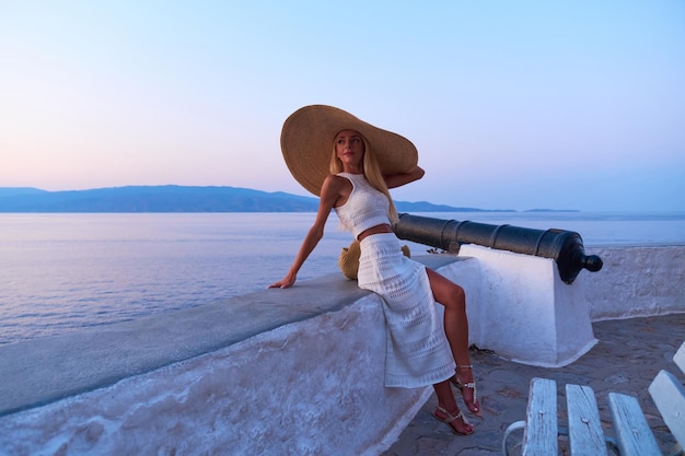 Beautiful girl tourist walking in the streets of Hydra Greece