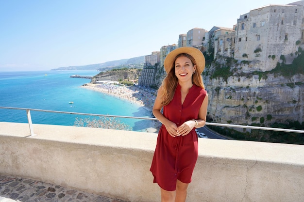 Beautiful girl in Tropea Italy Cute young tourist woman visiting Tropea village on Coast of the Gods Calabria Italy