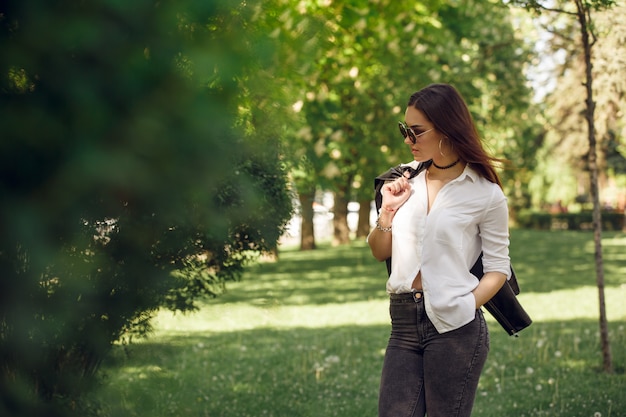 Beautiful girl walking park summer sun