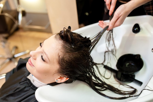 Beautiful girl washing their hair