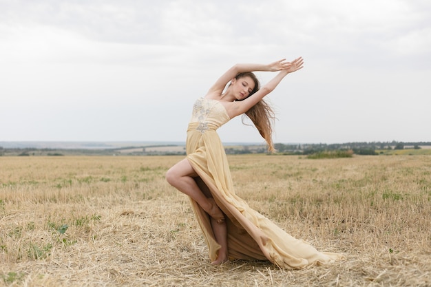 Beautiful girl in a wheat field