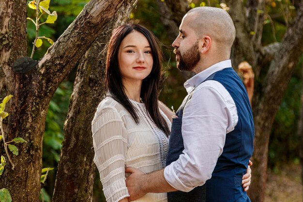 Beautiful girl in a white dress and a guy in a fruit pair