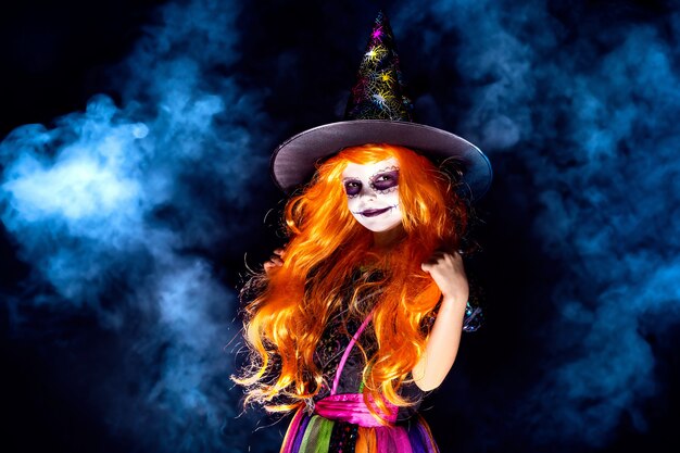 Beautiful girl in a witch costume