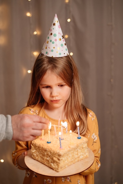 Beautiful girl with birthday cake.