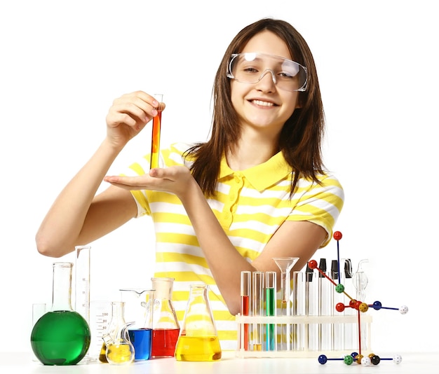 Beautiful girl with chemical flasks and testtubes isolated on white