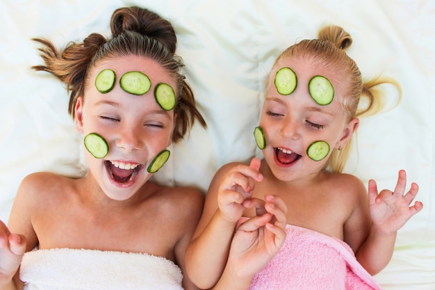 Beautiful girl with facial mask of cucumber. 