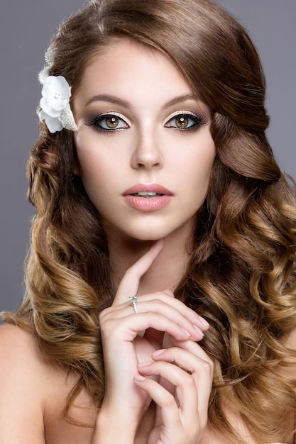 Beautiful girl with flowers in her hair