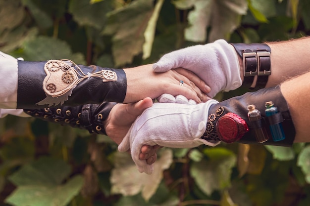 Beautiful girl with a guy couple in love in steampunk clothes