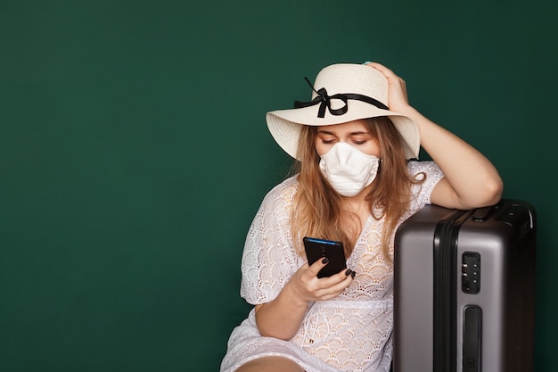 Beautiful girl with medical mask on the face