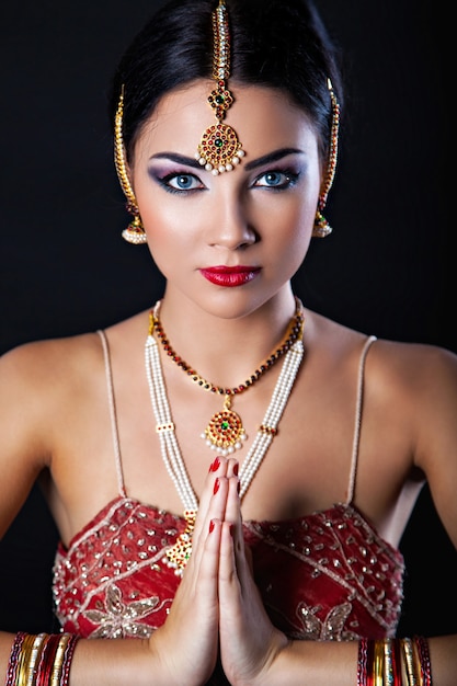 Beautiful girl with oriental makeup and Indian Jewelry, fashion look