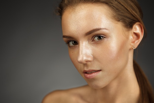 Beautiful girl with shiny skin Facial and cosmetic treatments