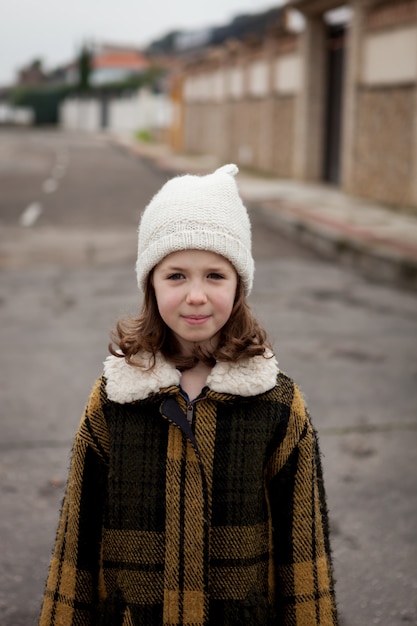 Beautiful girl with wool hat at winter 