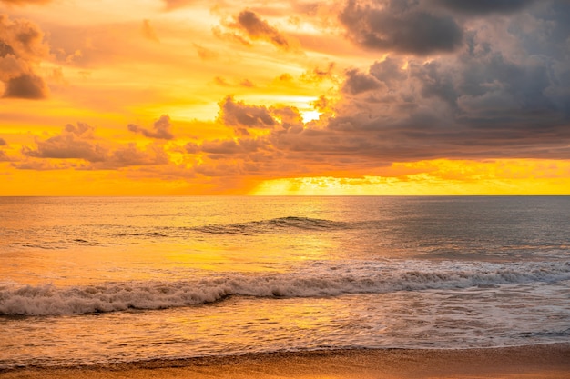 Beautiful glorious golden sunset and golden hour above the sea in evening