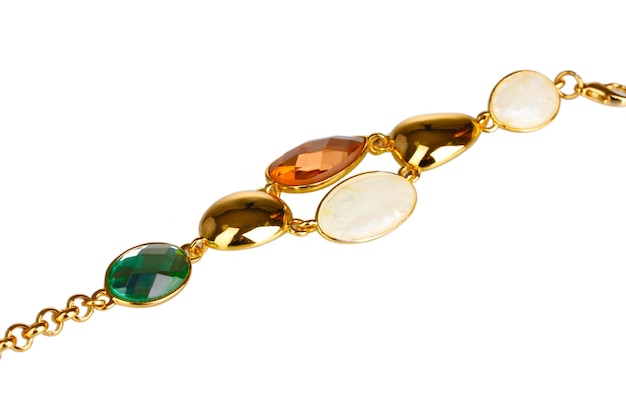 Beautiful golden bracelet with precious stones isolated on white