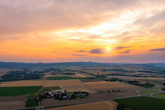 Beautiful golden sunset over wheat field rural scene top view