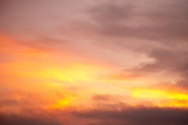 Beautiful gradiant orange clouds and sunlight on the blue sky perfect for the background take in everningTwilight rainy seasonwinter summer