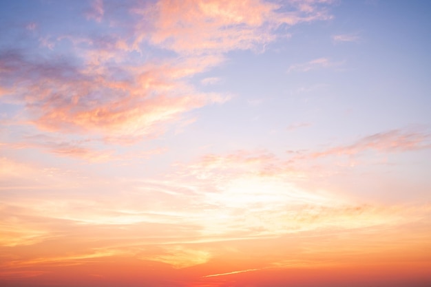 Beautiful gradient orange clouds and sunlight on the blue sky perfect for the background take in everningTwilight