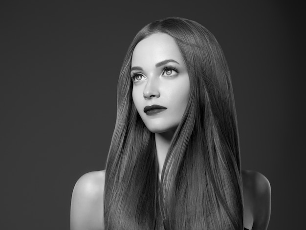 Beautiful hair woman healthy beauty hairstyle model. Studio shot. Monochrome. Gray. Black and white.